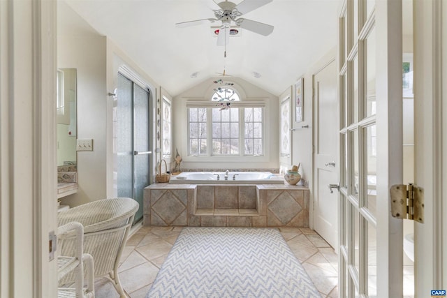 bathroom with lofted ceiling, a stall shower, tile patterned flooring, and a bath