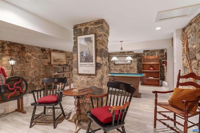 sitting room featuring wood finished floors and pool table