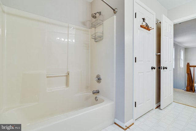 full bath with baseboards, shower / tub combination, and tile patterned floors