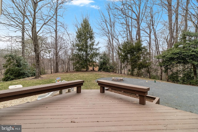 wooden deck featuring a fire pit