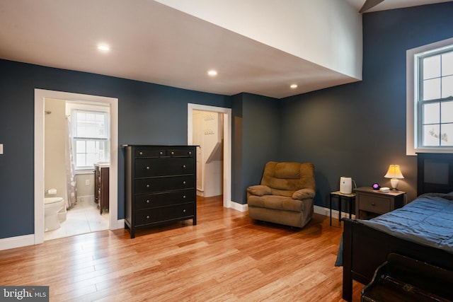 bedroom with recessed lighting, light wood-type flooring, connected bathroom, and baseboards