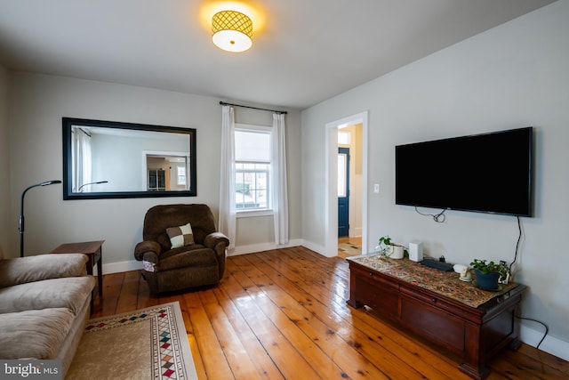 living room featuring light wood-style floors and baseboards