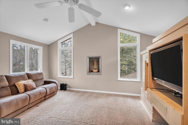 living area featuring carpet floors, vaulted ceiling with beams, baseboards, and ceiling fan