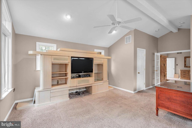 living room featuring lofted ceiling with beams, carpet floors, a ceiling fan, visible vents, and baseboards