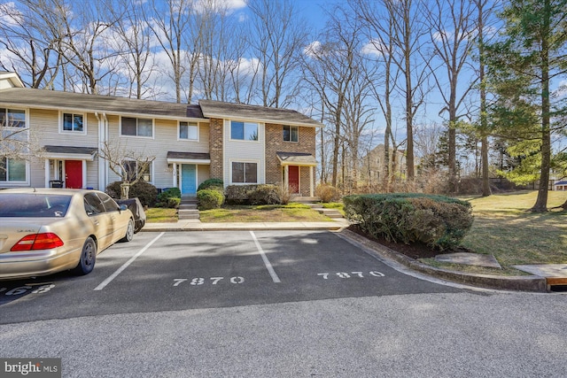 view of front of home featuring uncovered parking