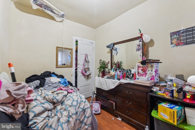 bedroom featuring wood finished floors