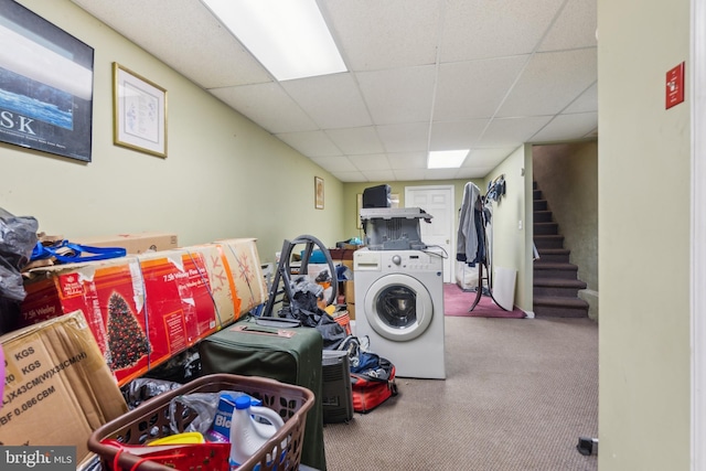 clothes washing area with washer / clothes dryer and laundry area