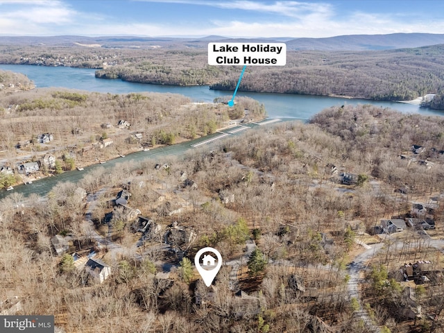 bird's eye view with a wooded view and a water and mountain view