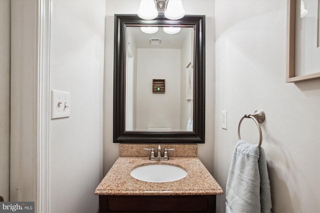 bathroom with visible vents and vanity