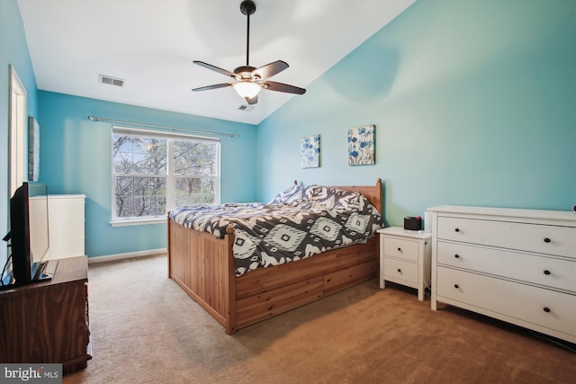 bedroom featuring carpet floors, visible vents, and lofted ceiling