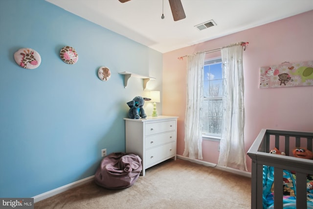 bedroom with baseboards, visible vents, a ceiling fan, and light colored carpet