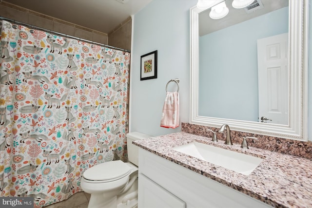 full bath with visible vents, toilet, a shower with curtain, tile patterned floors, and vanity