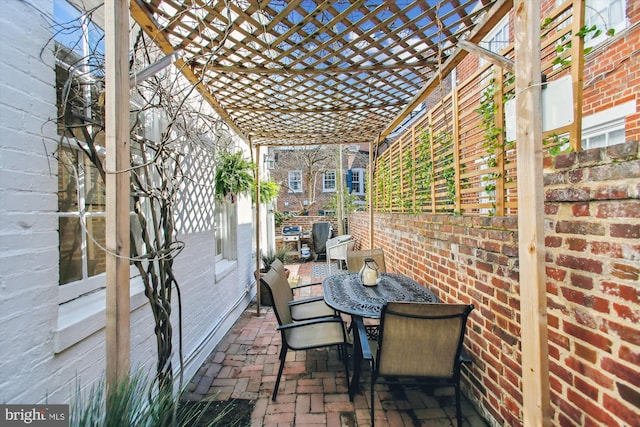 view of patio / terrace with outdoor dining area and a pergola