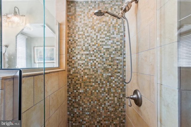 full bathroom with a tile shower