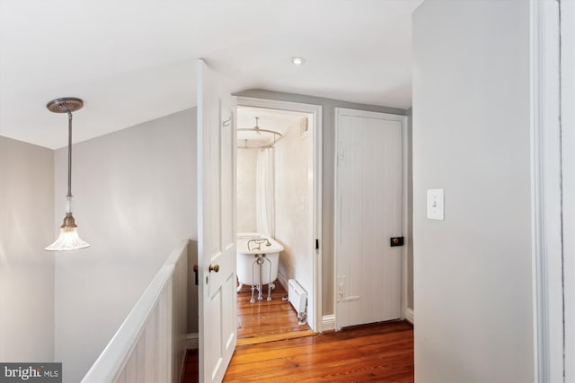 hall with wood finished floors