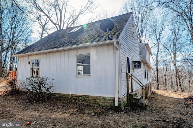 view of property exterior featuring roof with shingles