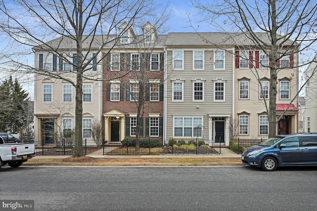 multi unit property with a fenced front yard