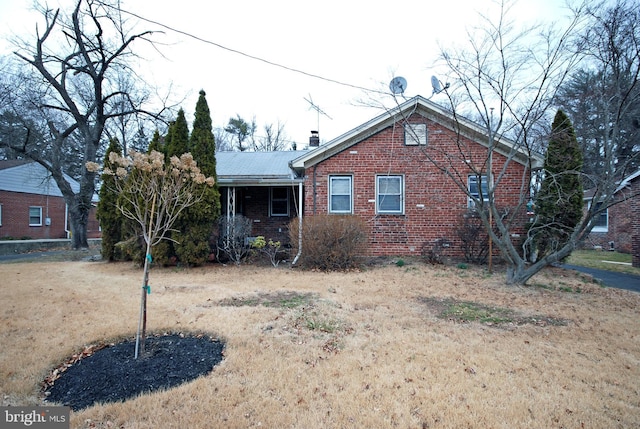 view of front of house featuring brick siding