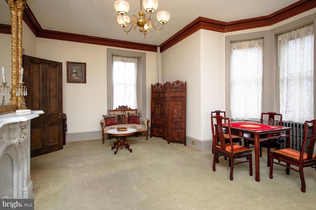 carpeted dining room featuring a chandelier, radiator, crown molding, and baseboards