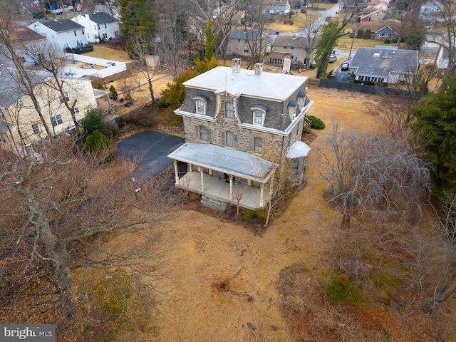 birds eye view of property with a residential view