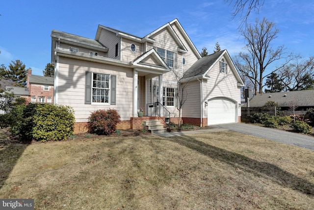 traditional-style home with a garage and aphalt driveway