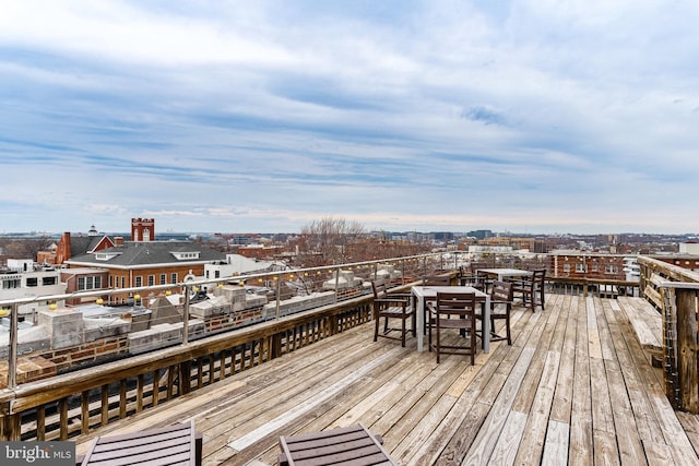 wooden terrace featuring outdoor dining space