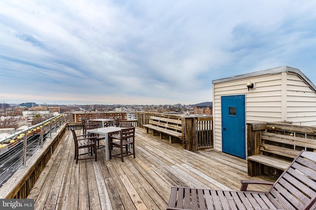 deck featuring outdoor dining area