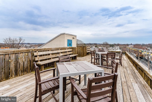 wooden terrace with outdoor dining area