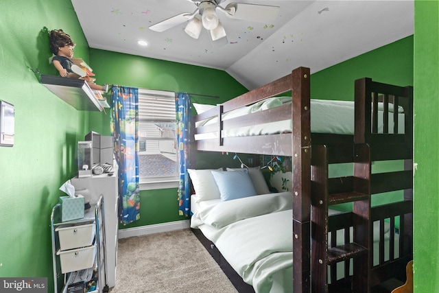 bedroom featuring carpet, vaulted ceiling, and baseboards