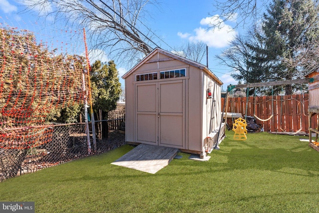 view of shed featuring a fenced backyard