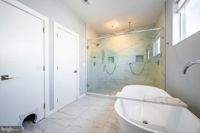 full bathroom with a marble finish shower, visible vents, a soaking tub, marble finish floor, and a sink