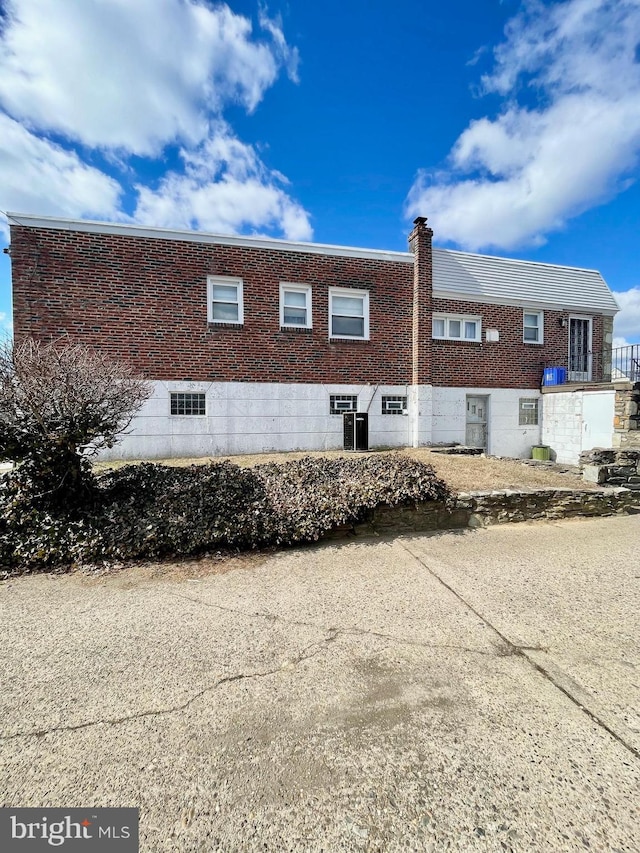 view of home's exterior with brick siding