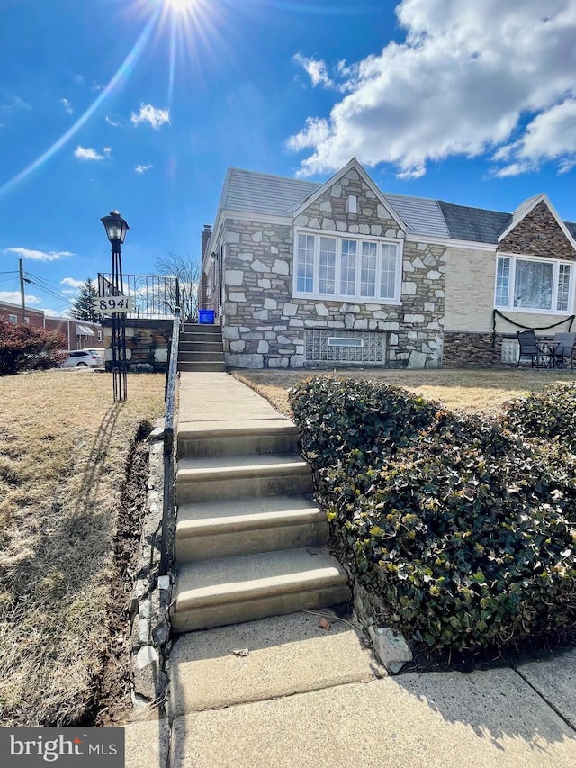 view of front of property featuring stone siding