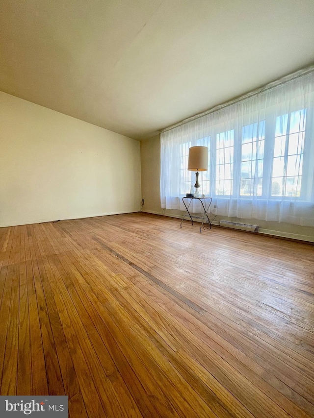 unfurnished living room featuring wood-type flooring