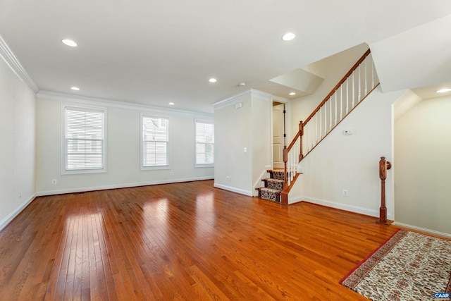 unfurnished living room with crown molding, recessed lighting, wood-type flooring, baseboards, and stairs