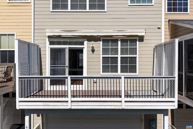 wooden terrace featuring a garage