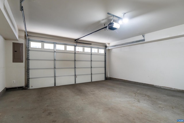 garage featuring electric panel, baseboards, and a garage door opener