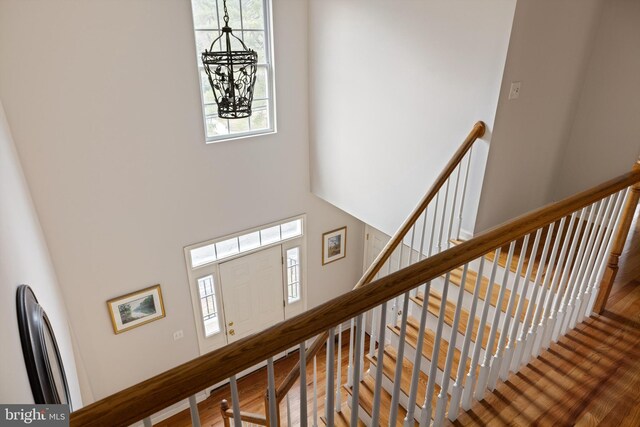 53 S Main St, Stockton, NJ 08559 - stairs with a high ceiling, an inviting chandelier, and wood finished floors