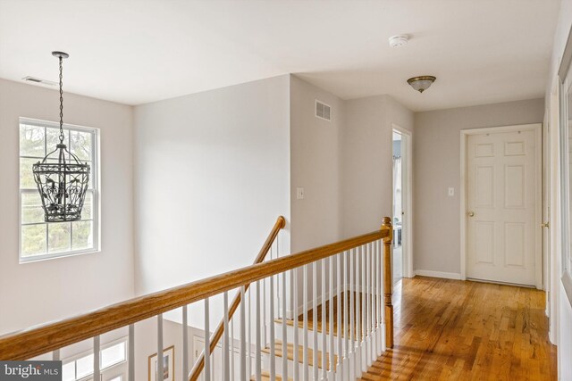 53 S Main St, Stockton, NJ 08559 - hall with baseboards, an upstairs landing, visible vents, and light wood-type flooring
