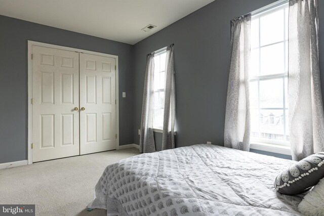 53 S Main St, Stockton, NJ 08559 - bedroom featuring baseboards, visible vents, a closet, and carpet