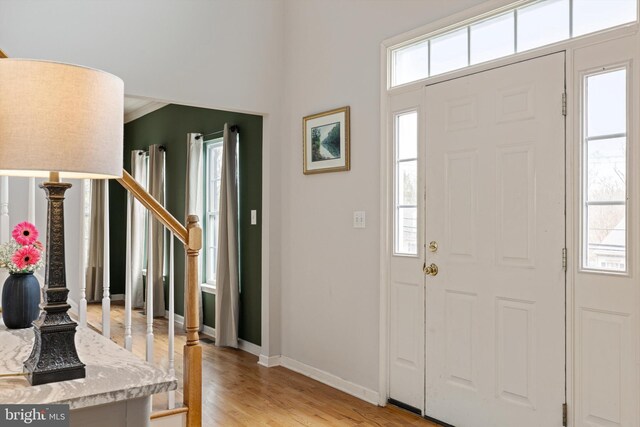 53 S Main St, Stockton, NJ 08559 - entryway featuring baseboards, light wood-style flooring, a healthy amount of sunlight, and stairway
