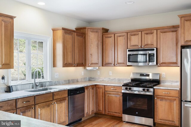 53 S Main St, Stockton, NJ 08559 - kitchen featuring a sink, brown cabinets, stainless steel appliances, light wood-style floors, and recessed lighting