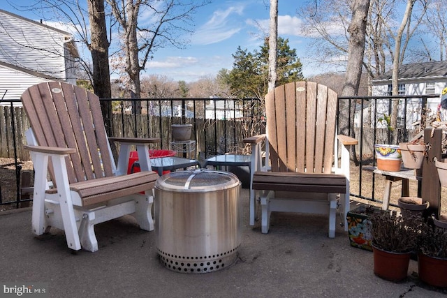 view of patio / terrace featuring fence