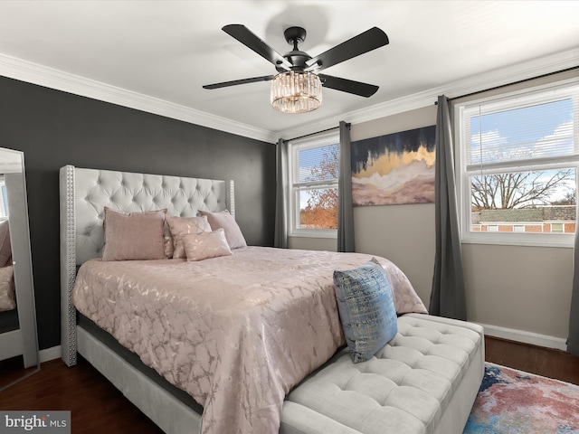 bedroom with ornamental molding, ceiling fan, baseboards, and wood finished floors