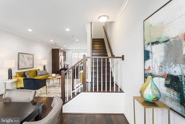 staircase featuring ornamental molding, recessed lighting, baseboards, and wood finished floors