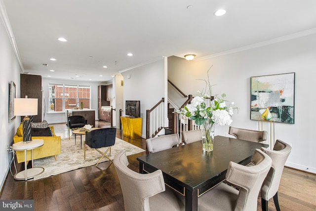 dining space with stairs, hardwood / wood-style floors, recessed lighting, and crown molding