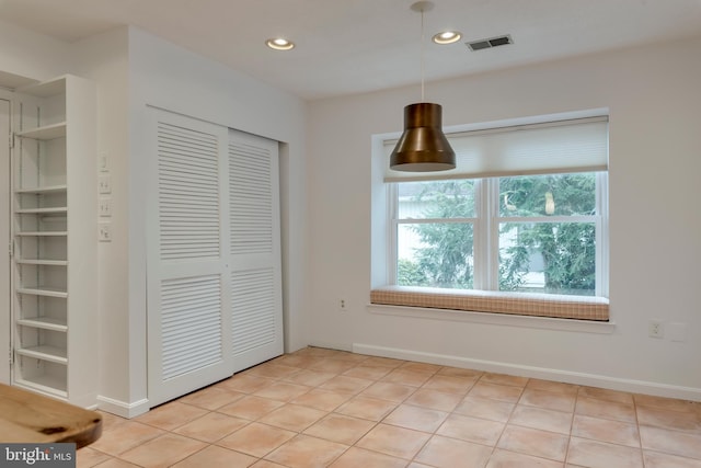 interior space featuring built in features, recessed lighting, visible vents, and light tile patterned flooring