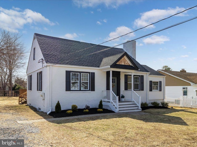 bungalow with brick siding, fence, a chimney, and roof with shingles