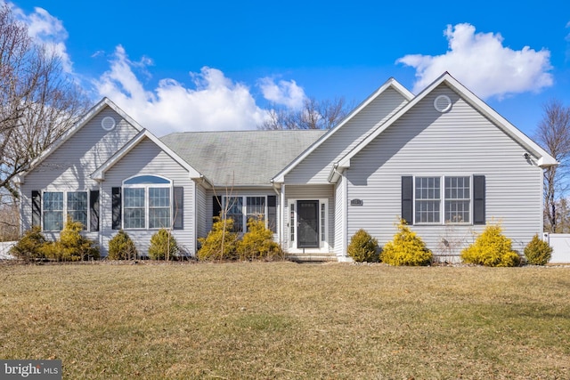 ranch-style home with a front lawn