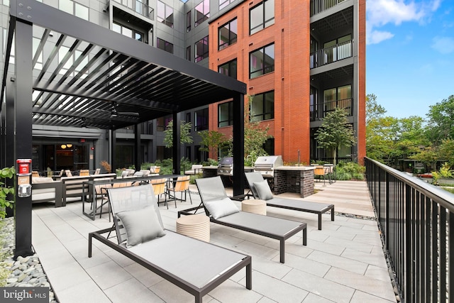 view of patio featuring a grill, area for grilling, and a pergola